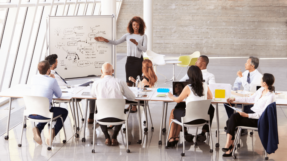 A CEO giving a presentation at a board meeting